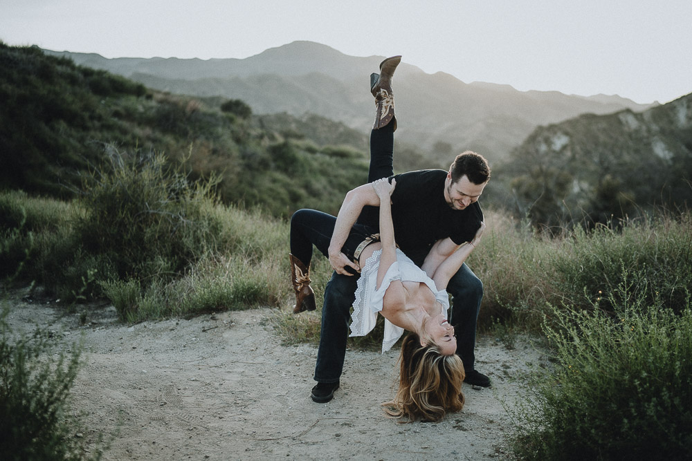 Couple dances during engagement session in los angeles canyon