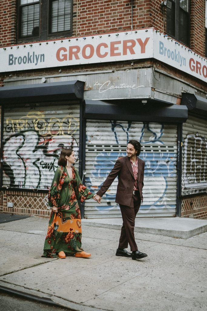 Couple walks in brooklyn street during elopement