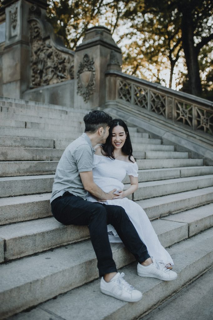 Expecting couple in central park at bethesda terrace during maternity photoshoot