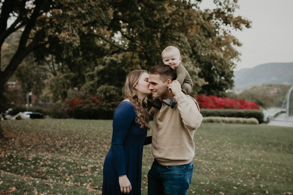Parents and baby during fall family session in west point