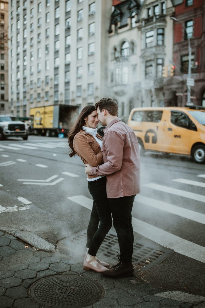 Couple in street fog during engagement shoot in nyc