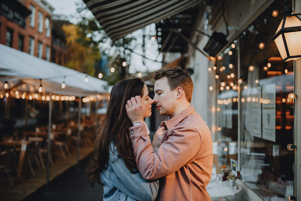 Couple kiss during engagement shoot in the west village of nyc