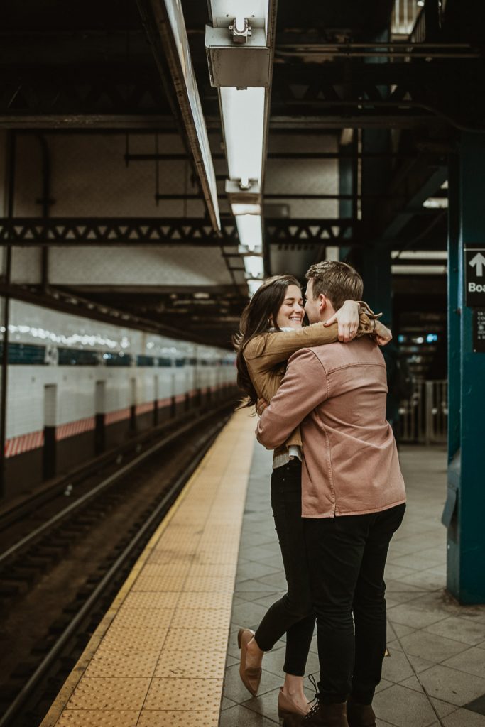 Couple during engagement shoot in the nyc subway