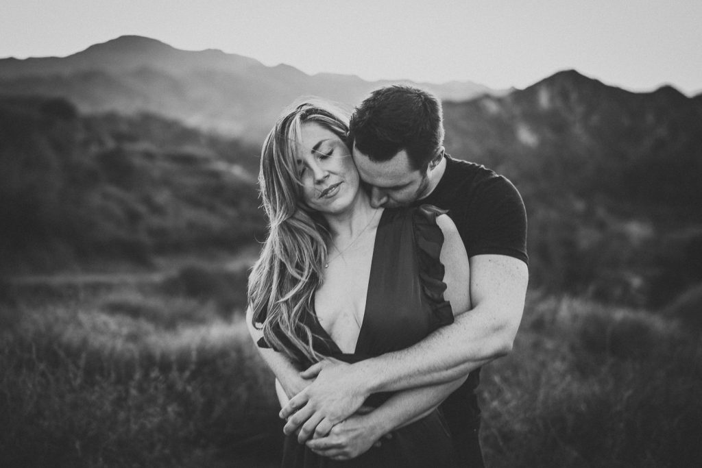 Couple during engagement session in los angeles canyon at golden hour