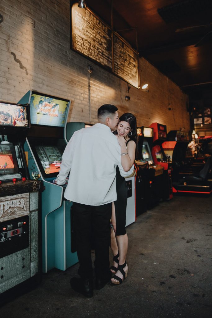Couple during engagement photo session at bar in williamsburg
