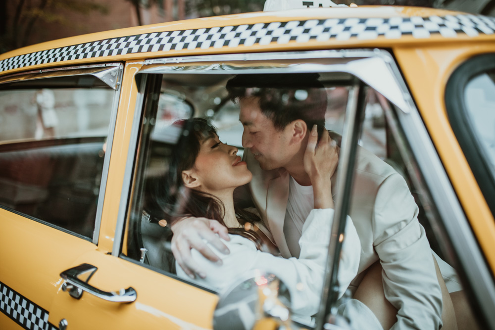 An epic New York City Elopement in Manhattan Photoshoot with a Vintage Taxi Cab.