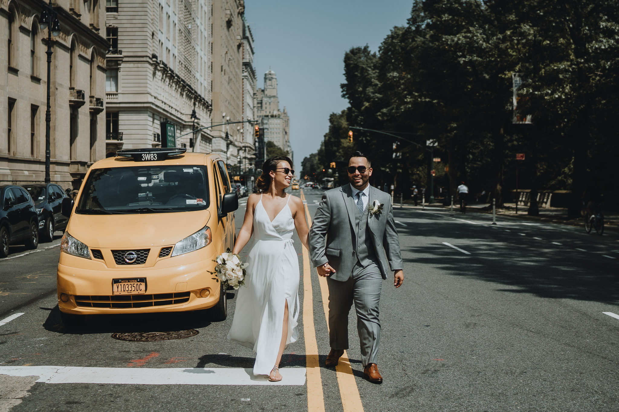 Bride and groom with yellow cab at nyc elopement