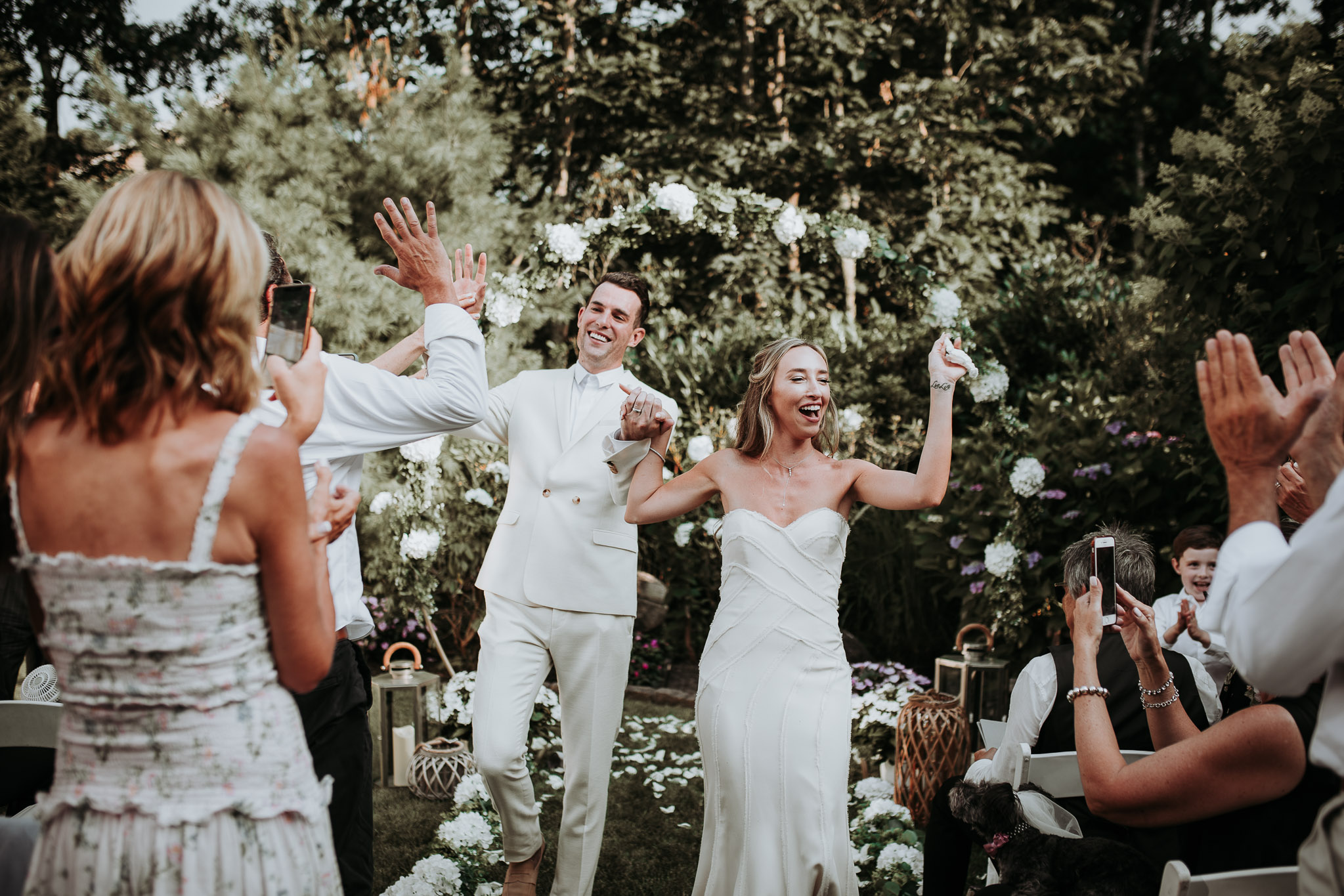 Bride and groom recessional at hamptons backyard wedding