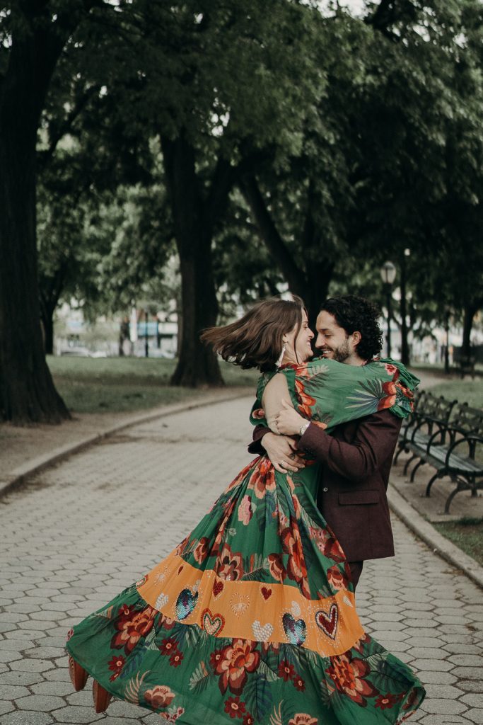 Groom twirls bride in brooklyn park during elopement