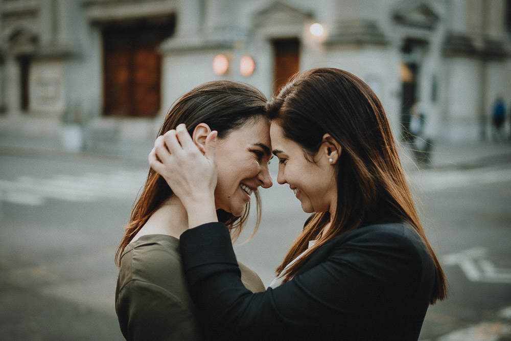 Lesbian couple kissing in nyc street during engagement session
