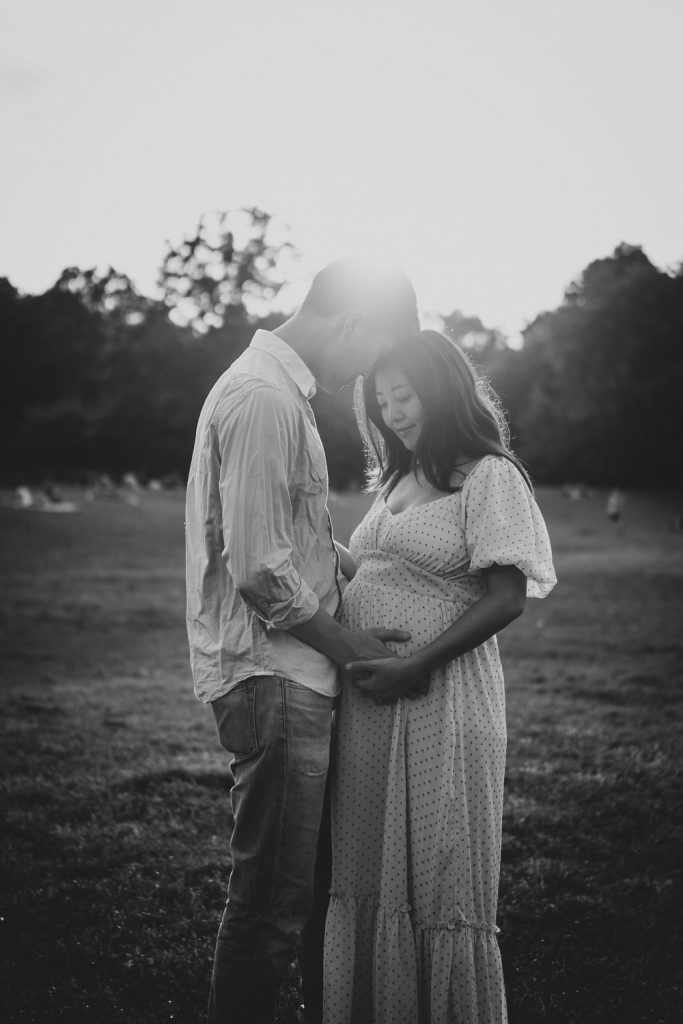 Expecting couple in prospect park at golden hour during maternity session