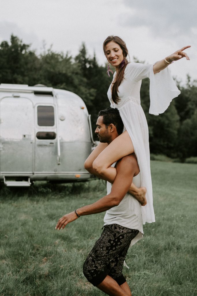 Couple dancing in front of airstream during engagement session in the hudson valley