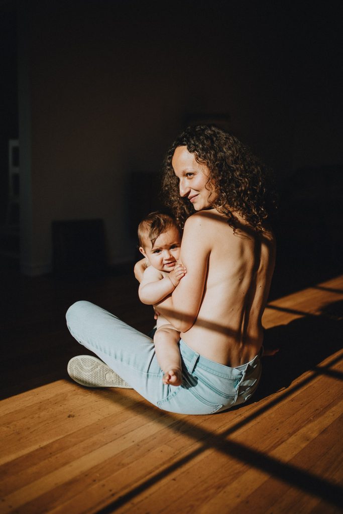 Mom and daughter during in home motherhood photoshoot in brooklyn