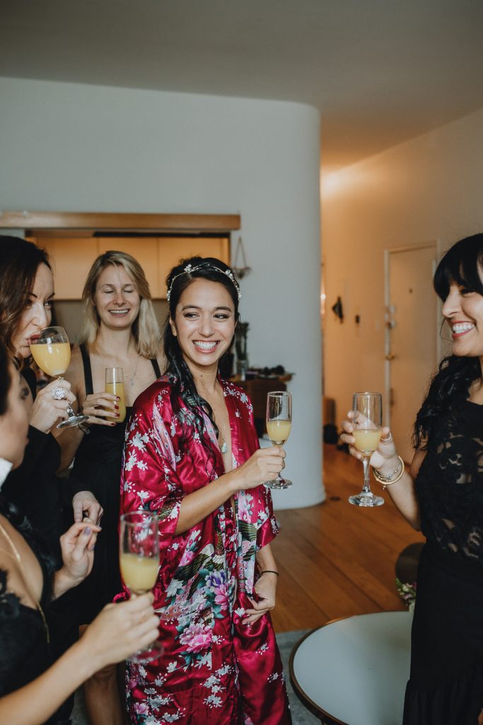 Bride getting ready with bridesmaids before nyc fall wedding