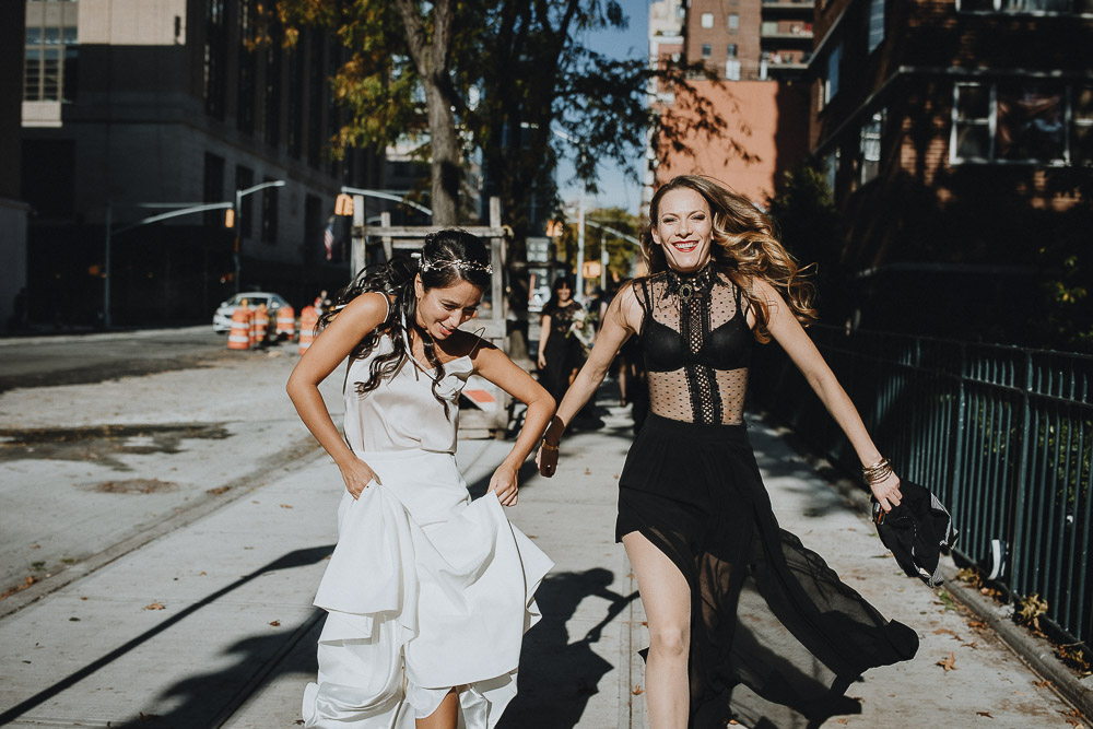 Badass bride and bridesmaid in streets of nyc before fall wedding