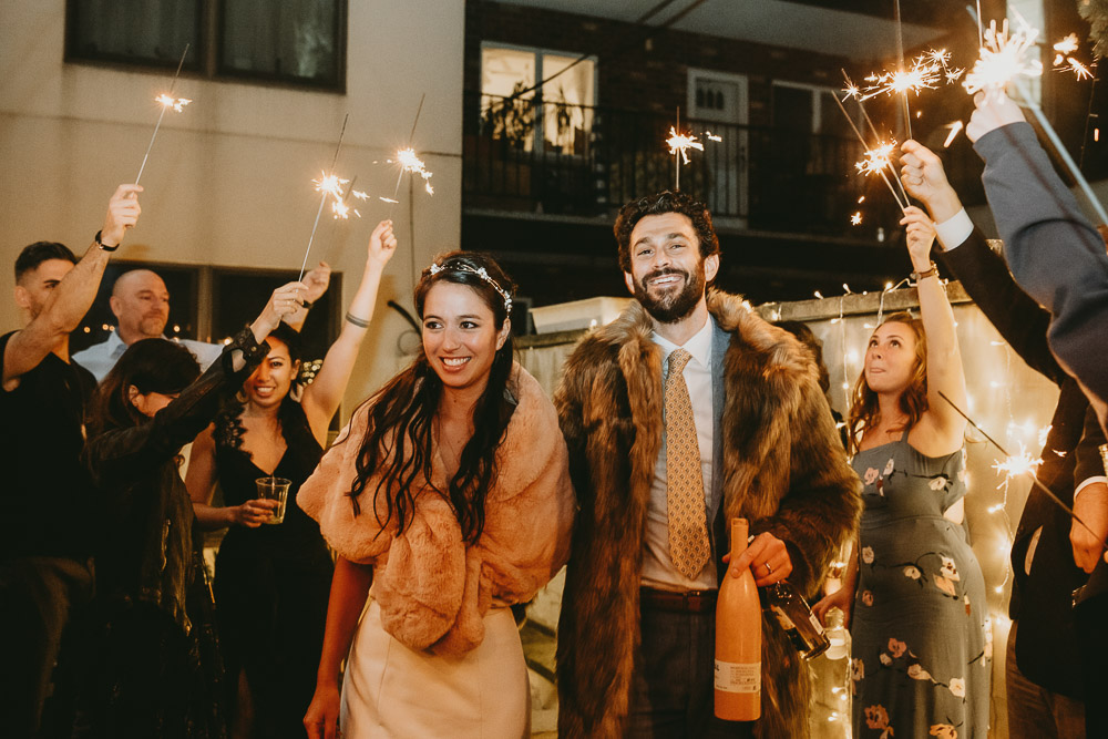Bride and groom's sparklers exit at brooklyn backyard wedding