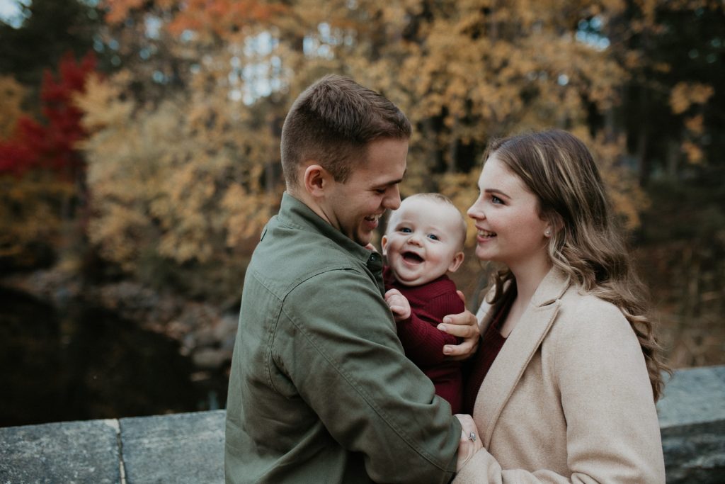 Parents and baby during fall family session in west point
