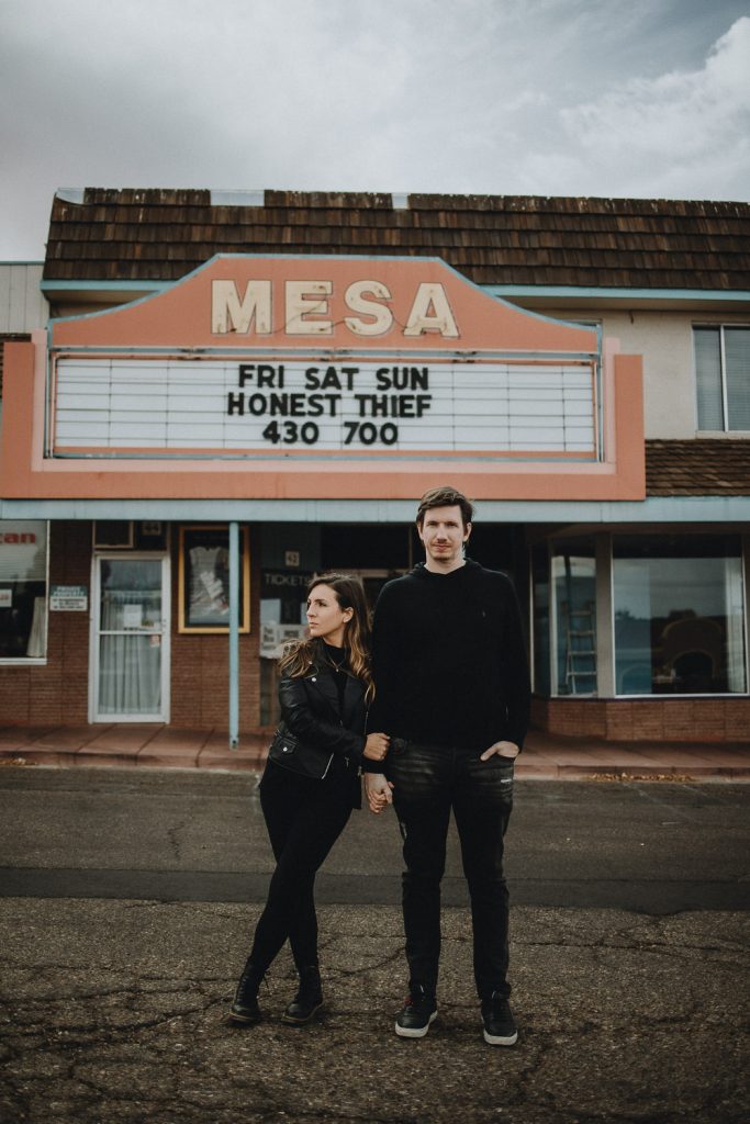 Couple in front of old cinema during arizona elopement