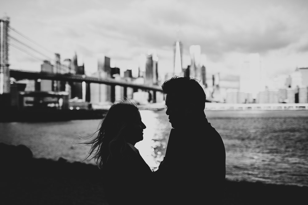 Silhouette of couple during engagement photoshoot in dumbo brooklyn