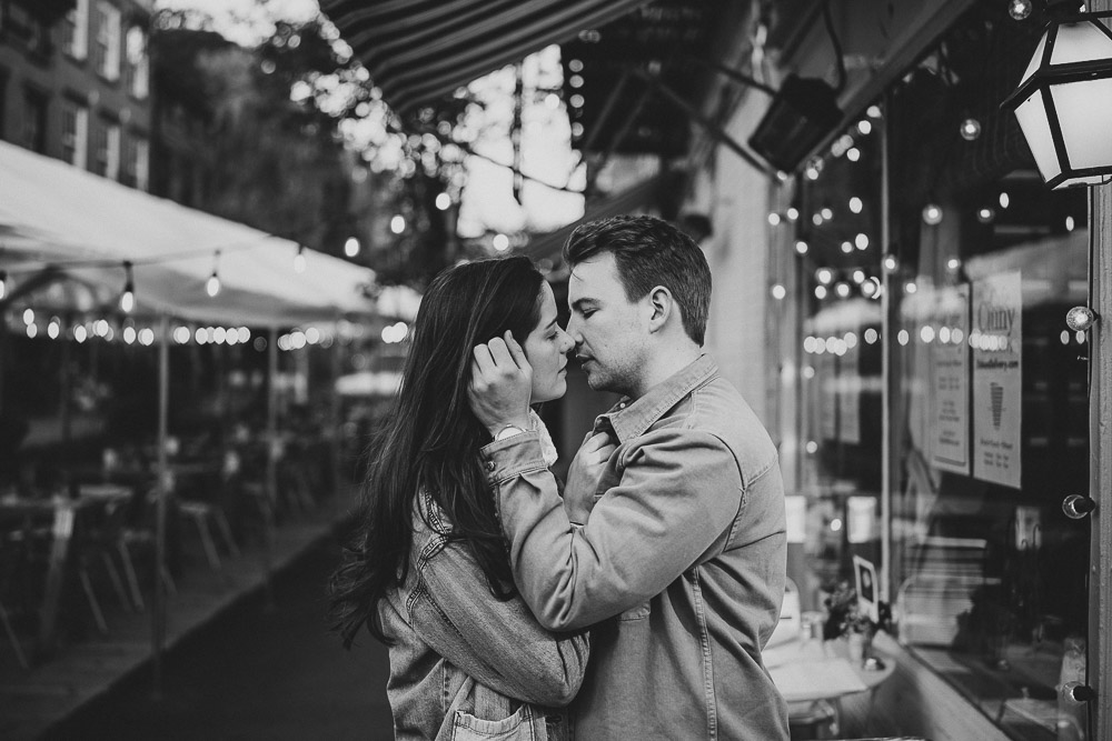 Couple kiss during engagement shoot in the west village of nyc