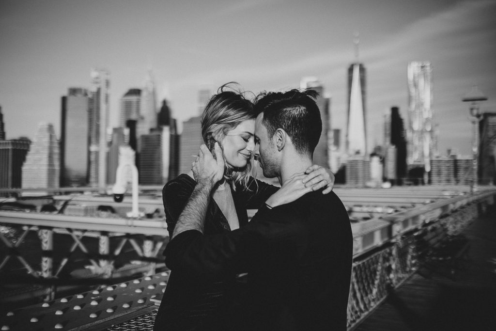 Couple on brooklyn bridge at sunrise during elopement photoshoot