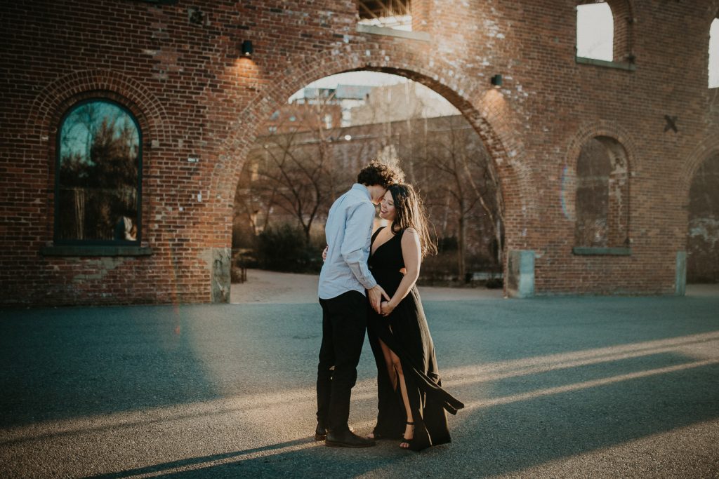 Expecting couple during maternity photoshoot in dumbo brooklyn