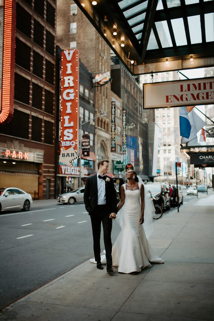Interracial bride and groom at nyc wedding in theatre district