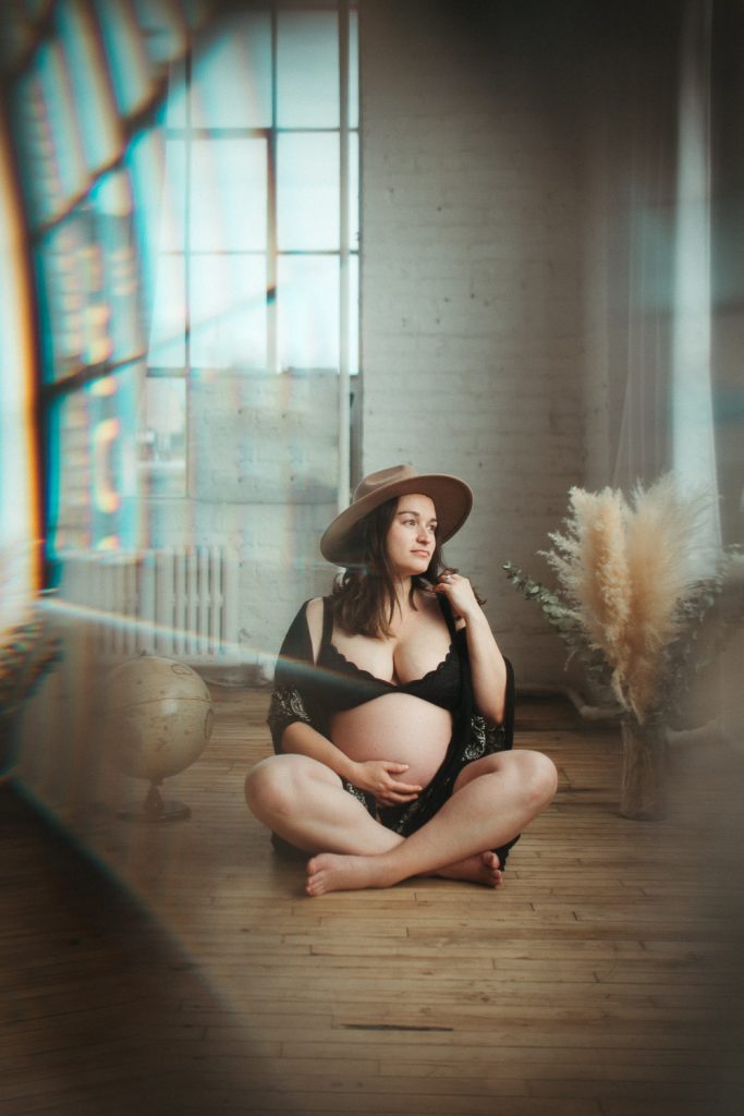 Pregnant woman during maternity photoshoot in brooklyn loft