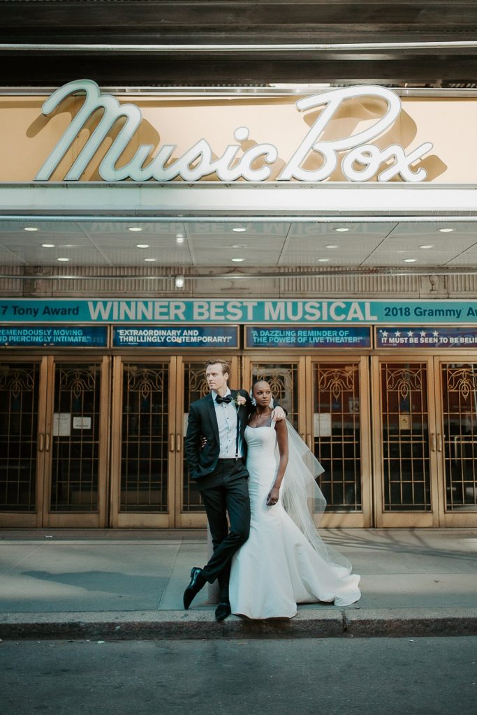 Interracial bride and groom at nyc wedding in theatre district