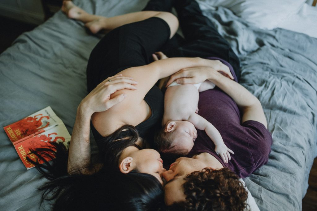 Parents sleep with baby during newborn in home session in nyc