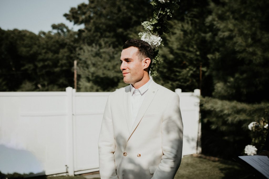 Groom cries at wedding ceremony in the hamptons