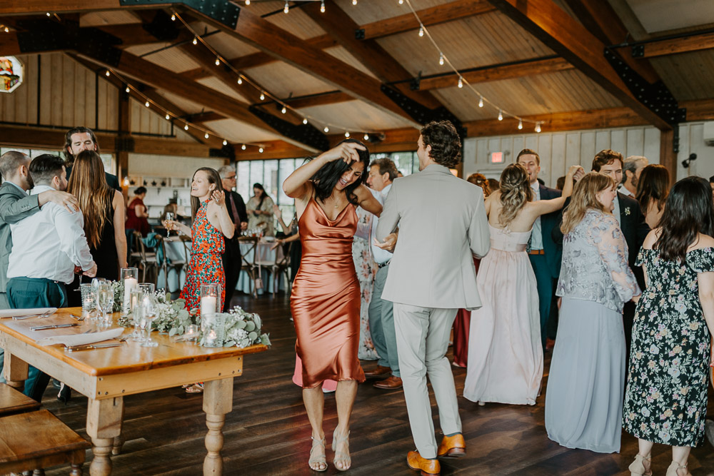 Guests dancing at red maple vineyard wedding reception