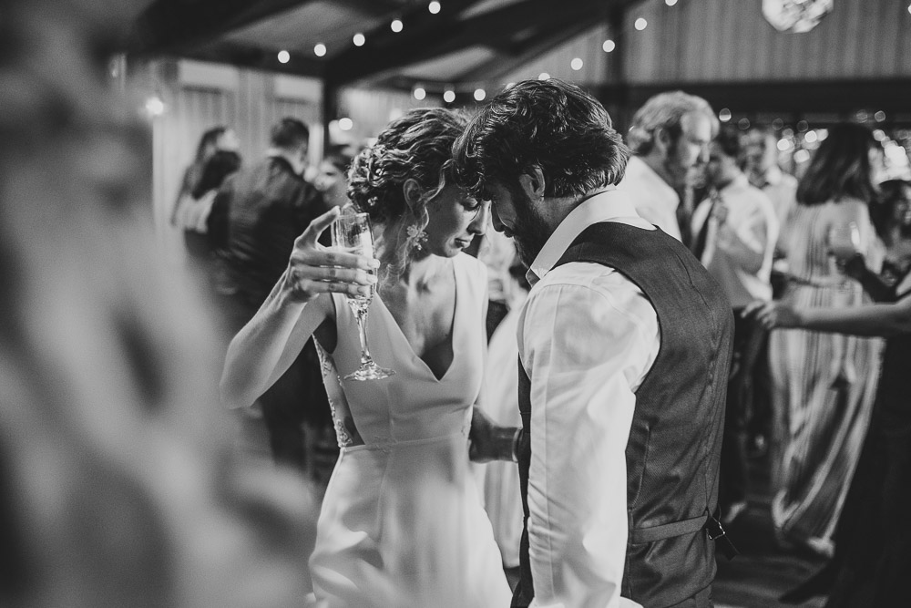 Bride and groom dancing at red maple vineyard wedding reception
