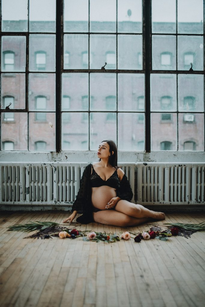 Pregnant woman during intimate maternity session at home in brooklyn