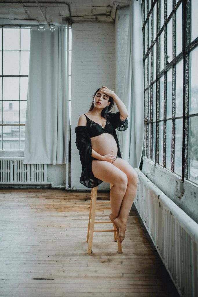 Pregnant woman during intimate maternity session at home in brooklyn