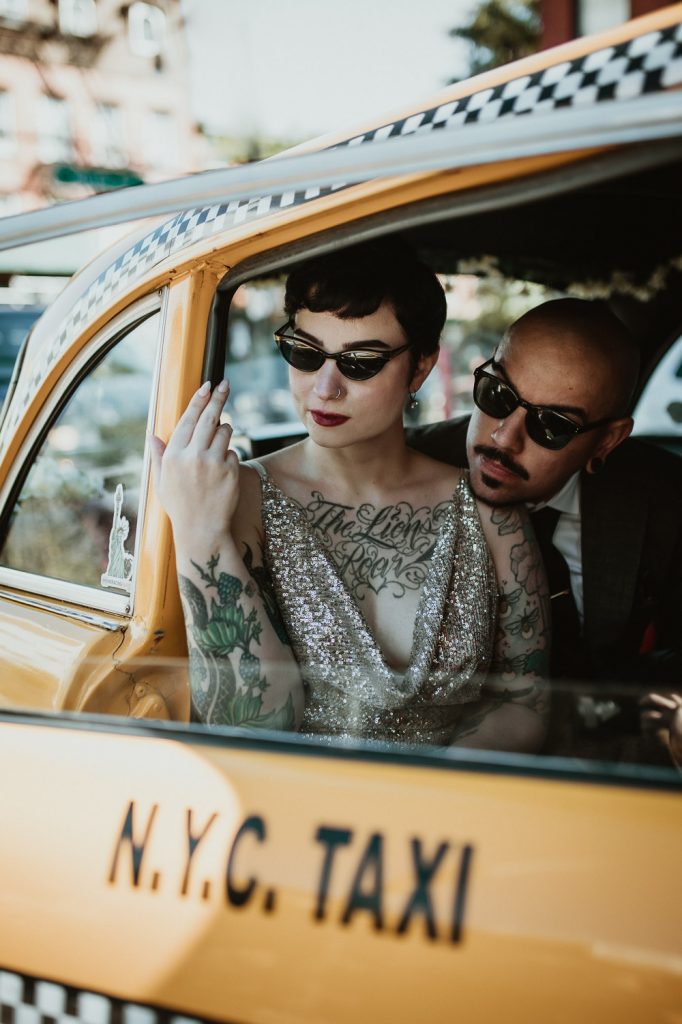 Edgy bride and groom in vintage cab during brooklyn elopement