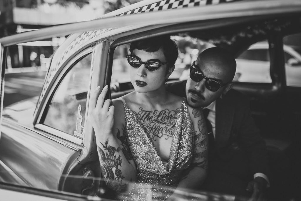 Edgy bride and groom in vintage cab during brooklyn elopement