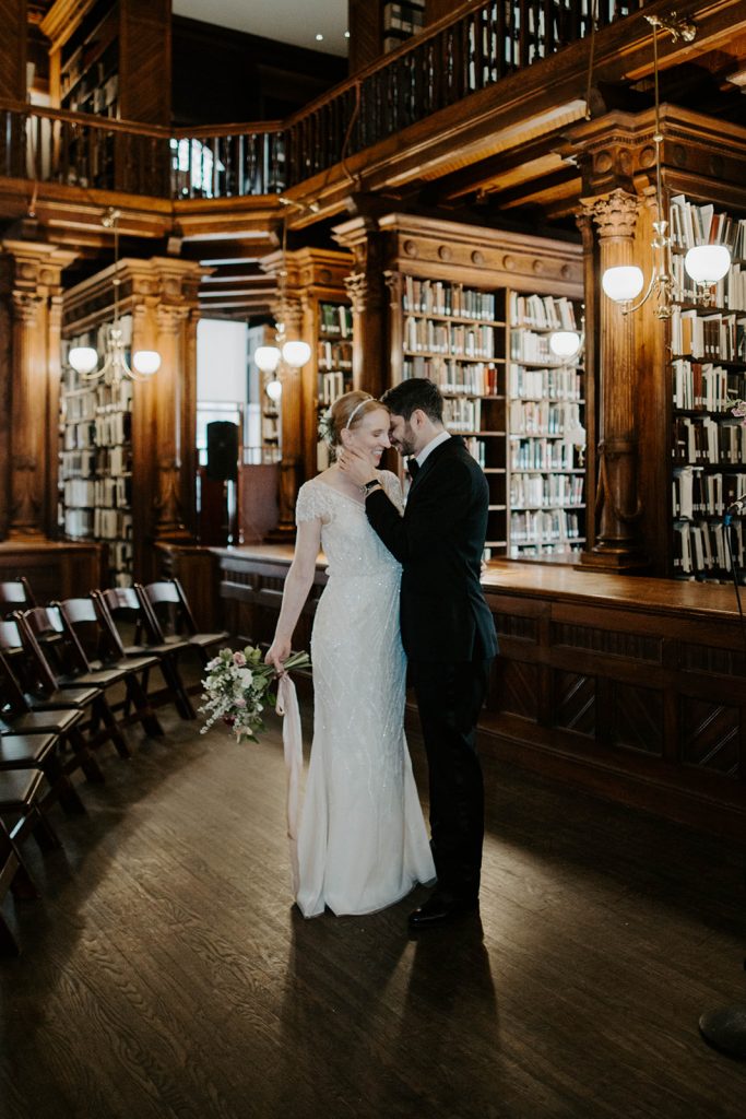 Bride & groom in old library at center for brooklyn history wedding