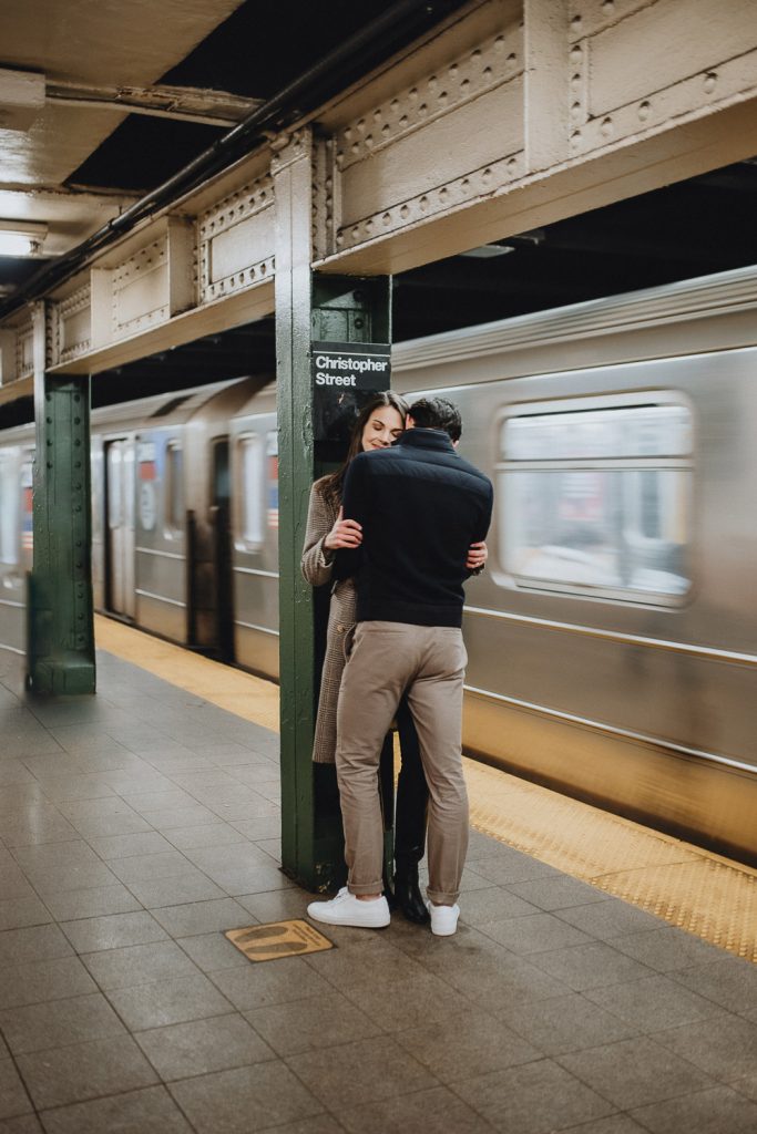 Couple during engagement shoot in nyc subway