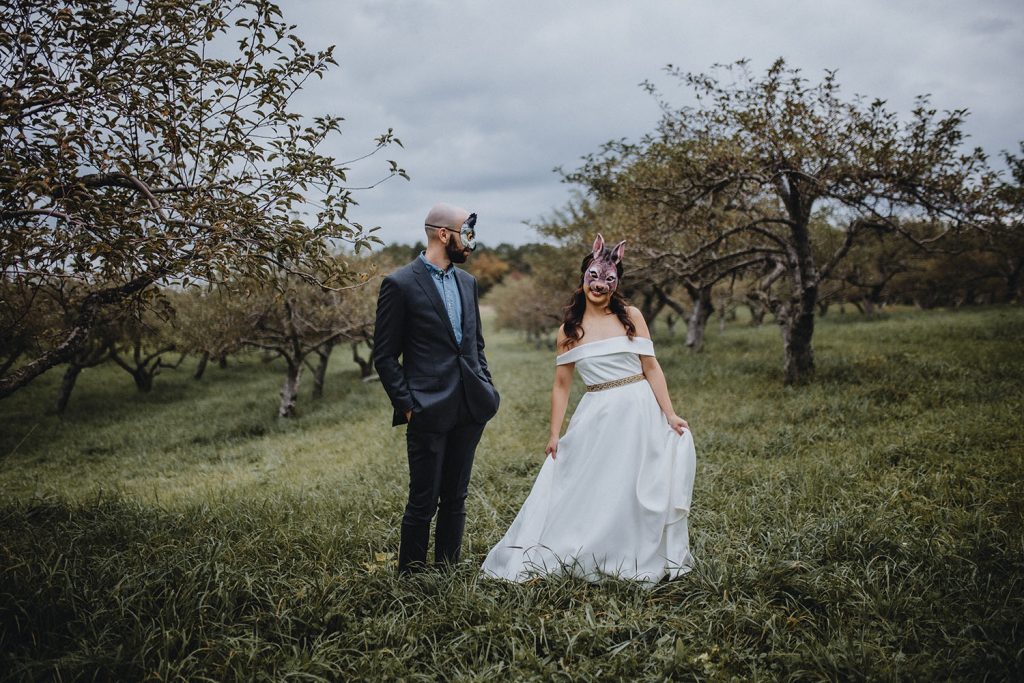 couples photos with animal masks at fall wedding in Hudson Valley