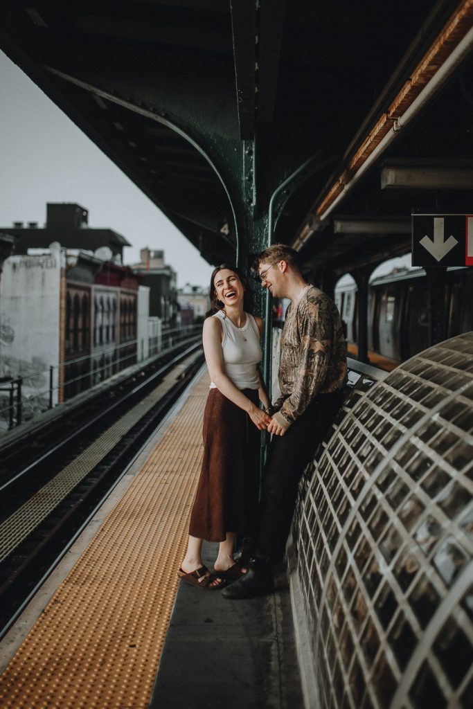 Couple during engagement session in nyc subway