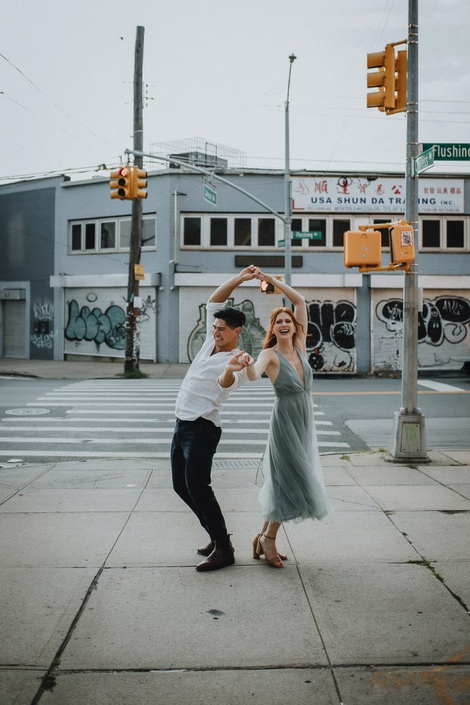 Couple during fun engagement photoshoot in bushwick brooklyn