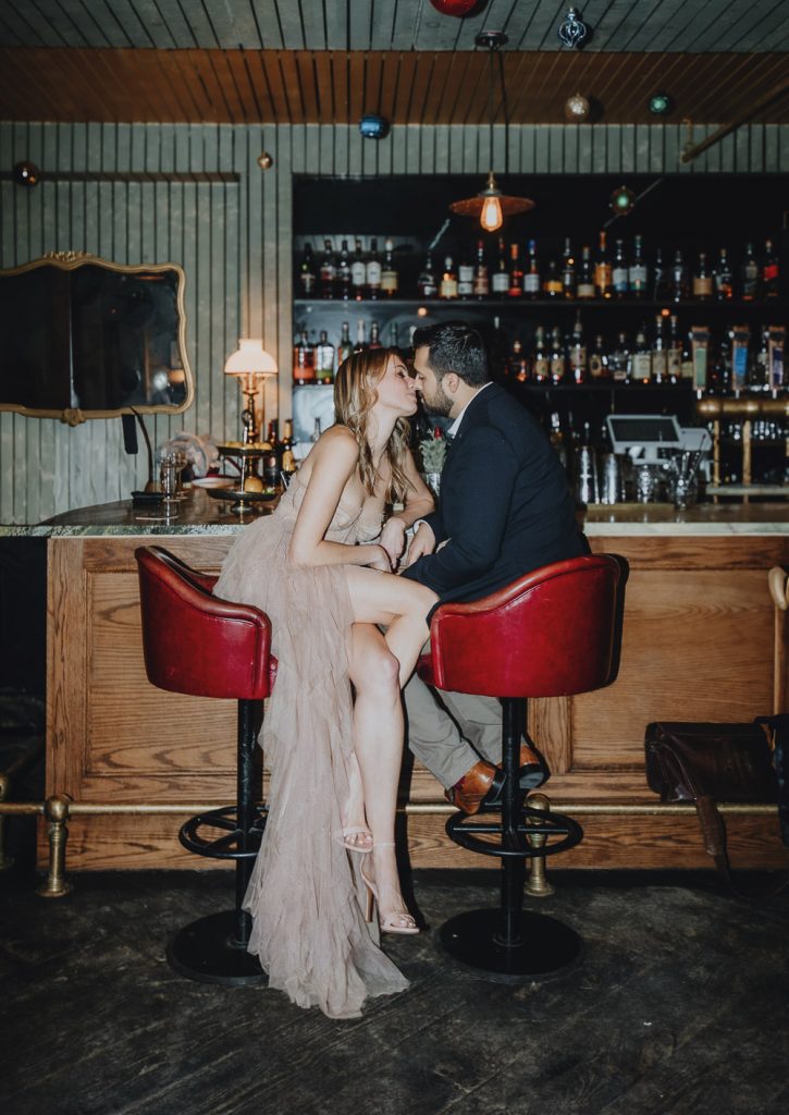Bride in groom in brooklyn bar at wedding after party