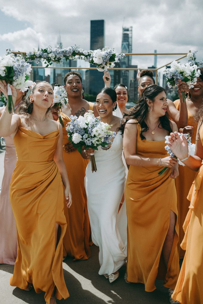 Fun bridal party photo at nyc wedding by skyline
