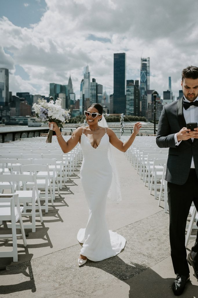 Bride and groom at wedding by nyc skyline