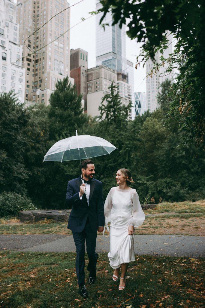 Bride and groom during rainy fall elopement in central park