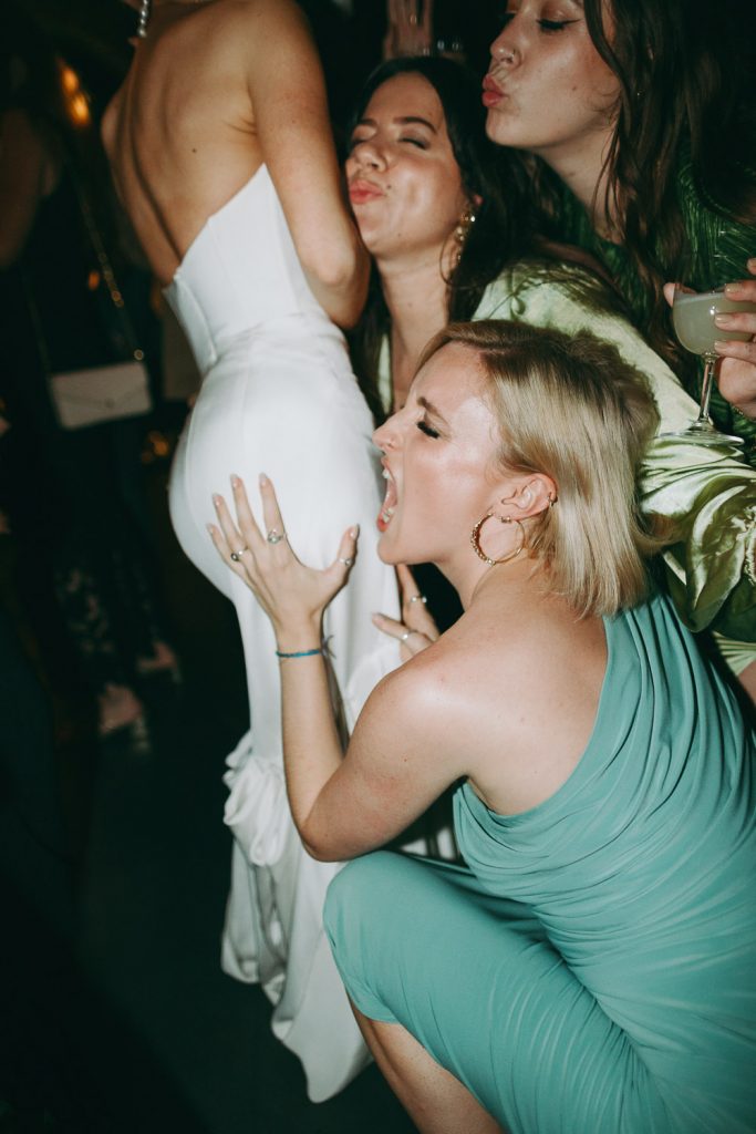 Fun photo of wedding reception on dance floor