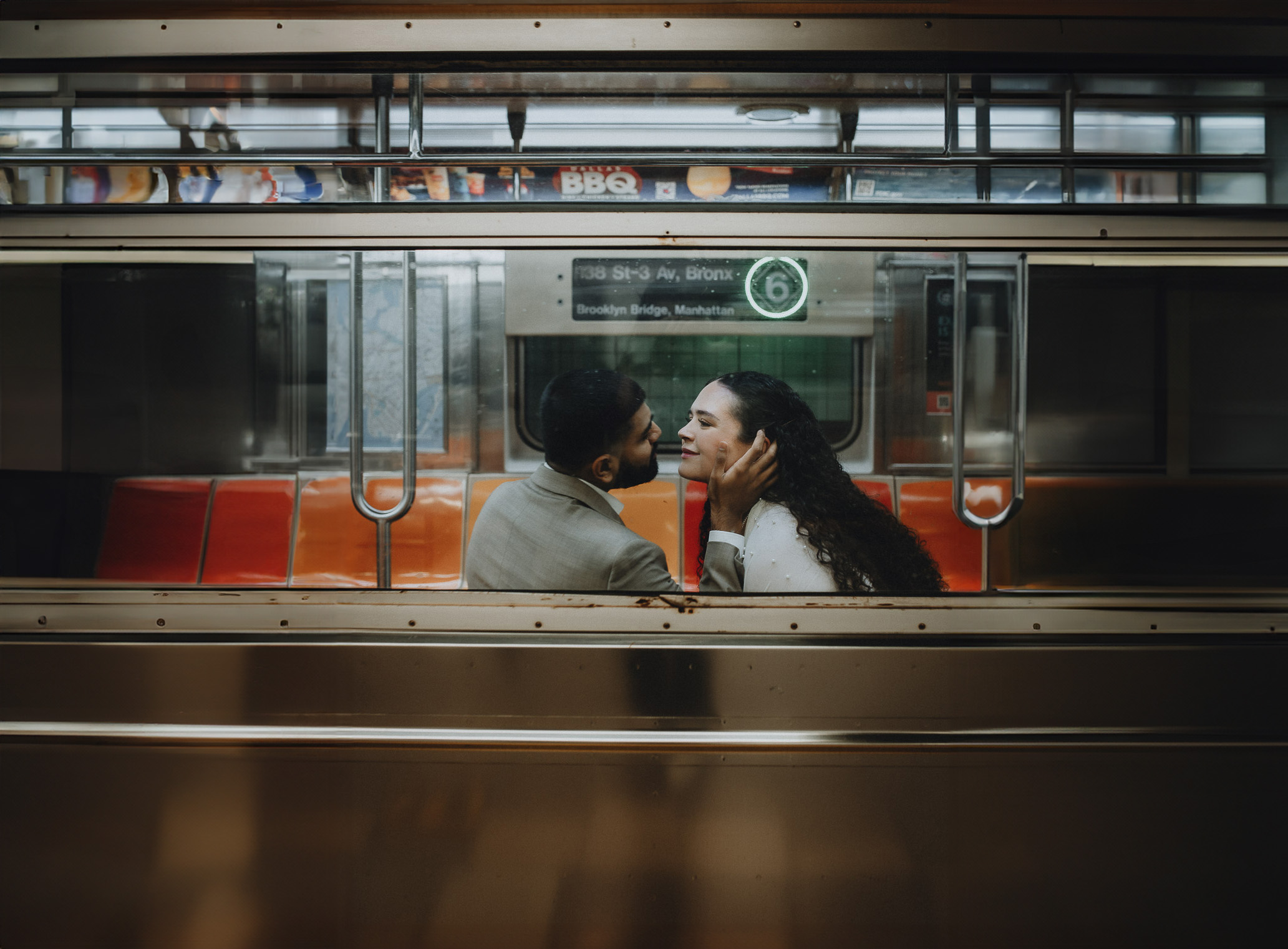 Bride and groom riding nyc subway on elopement day