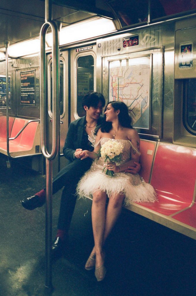 Bride and groom in nyc subway during elopement wedding