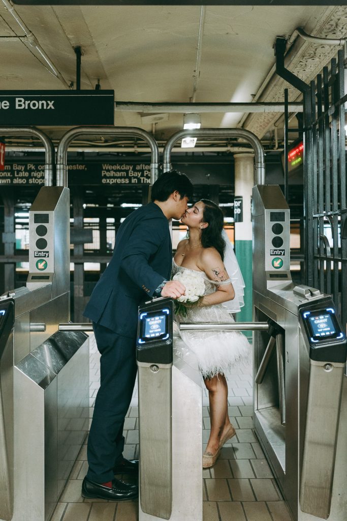 Bride and groom in nyc subway during elopement wedding